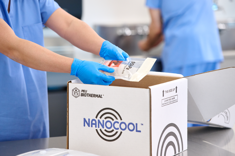 Healthcare professional preparing a NanoCool™ temperature-controlled shipper for decentralized patient sample collection